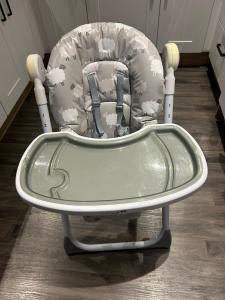 a childs rocking chair with a childs car seat at Blissful Lodge Haven Lakeland in Flookburgh
