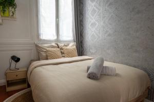 Postel nebo postele na pokoji v ubytování Au cœur de Rouen