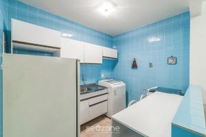 Η κουζίνα ή μικρή κουζίνα στο Aptos na Orla de Balneário Camboriú - IPTR +59 φωτογραφίες