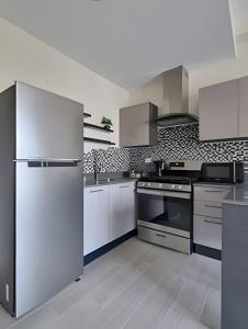 Kuchyň nebo kuchyňský kout v ubytování Sunset Light at Punta Cana , Vista Cana