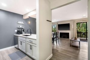 an open kitchen and living room with a dining room at Top Notch - Condo for 6 in Branson