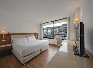 Ένα ή περισσότερα κρεβάτια σε δωμάτιο στο Hotel Chico 97 By OxoHotel
