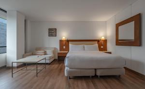 Ένα ή περισσότερα κρεβάτια σε δωμάτιο στο Hotel Chico 97 By OxoHotel +75 φωτογραφίες