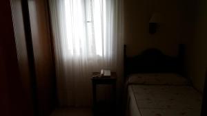 Posteľ alebo postele v izbe v ubytovaní Hotel Cortijo