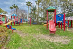 a playground with colorful play equipment in a park at Palms of Destin 1307 in Destin