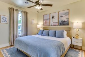 a bedroom with a large bed and a ceiling fan at 12 Mi to BOK Center Pet-Friendly Home with Yard! in Union +21 photos