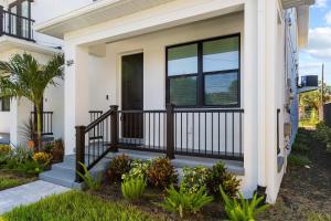a front porch of a house with a balcony at New build in Old West #2 3 Bed 2 Bath Family Rental in Tampa