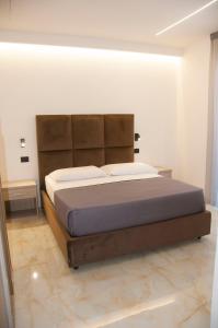 Postel nebo postele na pokoji v ubytování D'ANNUNZIO suites + 37 fotografií