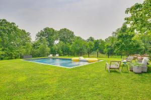 a swimming pool in the middle of a yard at Pool and Private Acreage Luxe Hudson Valley Home in Pine Plains