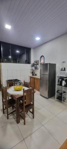 a kitchen with a table with bananas on it at Canto Mineiro in Tiradentes