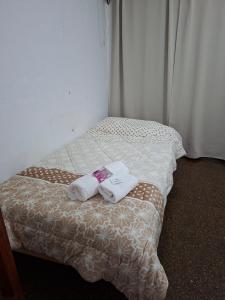 En eller flere senge i et værelse på Sumaï