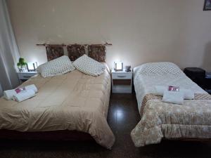 En eller flere senge i et værelse på Sumaï