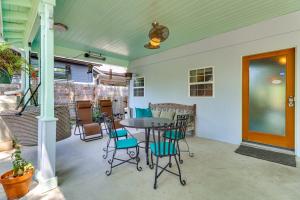 a patio with a table and chairs on it at Walk to Mueller Lake Park! Home with Patio and Yard in Austin