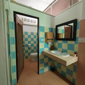 a bathroom with a sink and a toilet at Ao-Nang New! MATA Garden Bungalow-Apartments in Ao Nang Beach
