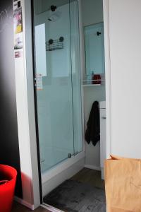 a glass shower in a room with a box at Night Sky Magic in Olive Grove in Gladstone