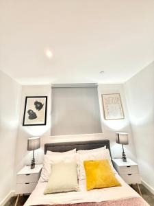 a bedroom with a bed with two night stands at Quiet Hideaway in London