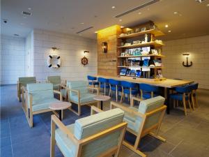 a restaurant with tables and chairs and a counter at Far East Village Hotel Yokohama - Vacation STAY 35241v in Yokohama