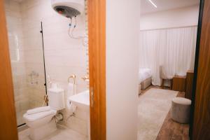 a bathroom with a toilet and a sink at Dar Atom pyramids in Cairo