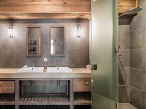a bathroom with two sinks and two mirrors at Appartement de Luxe 12 Pers. à 50m des Pistes, Spa, et Cheminée - Méribel - FR-1-565-7 in Les Allues +8 photos