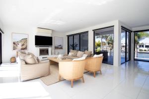 a living room with a couch and a table at Alua by Khove in Gold Coast