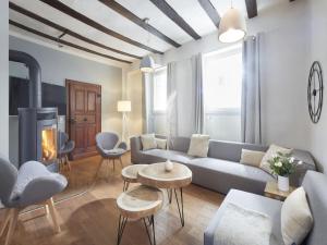 a living room with a couch and a fire place at Holiday home in Mosel with 3 bedrooms in Treis-Karden