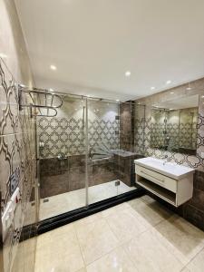 a bathroom with a shower and a sink at Kayan Pyramids View in Cairo