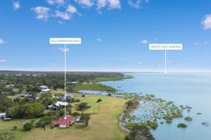 an aerial view of an island in the water at Beachfront Hervey Bay Homestead in River Heads