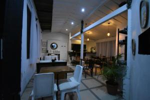 a room with chairs and a table and a dining room at Freddy`s Place B&B in Monteverde Costa Rica