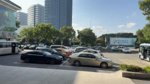 a parking lot full of cars in a city at Juyue hotel Hongqiao Airport in Shanghai