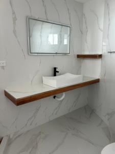 a bathroom with a sink and a mirror at Mar de Calafia 1 in Divisadero +31 photos