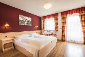 Voodi või voodid majutusasutuse Hotel Pradat toas