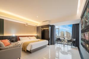 a hotel room with a bed and a view at Dori1993 Hotel in Changsha