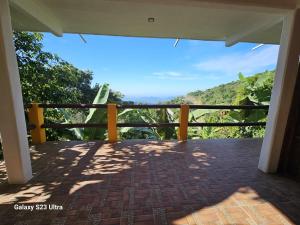 a view from the balcony of a house at Finca San Antonio in Pluma Hidalgo +8 photos