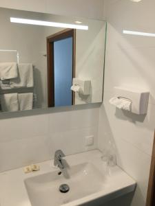 Koupelna v ubytování Hotel Faber