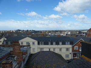 a large building with many windows on top of it at Weymouth Beach B&B - Adult Only in Weymouth