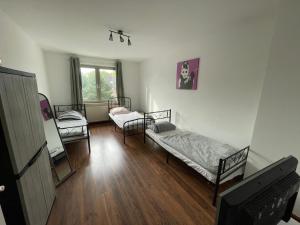 En eller flere senge i et værelse på MAD Ferienwohnungen 3