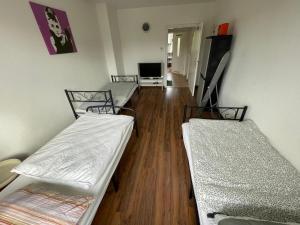 En eller flere senge i et værelse på MAD Ferienwohnungen 3