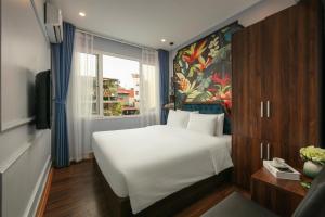 Ένα ή περισσότερα κρεβάτια σε δωμάτιο στο Elegance Premium Hotel +76 φωτογραφίες