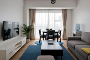 a living room with a couch and a table at Luxe Loft Kinoo in Kikuyu