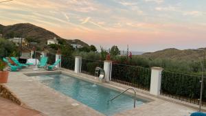 a swimming pool with a view of the mountains at Casa Rural Mi Abuela Maria in Mojácar
