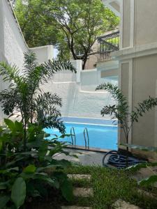 a view of a swimming pool from the side of a building at 2 BHK Retreat in Sierra Assagao in Assagao