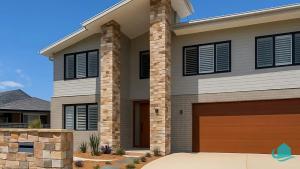 a rendering of a house with a garage at The Big Light House at Caves Beach in Caves Beach