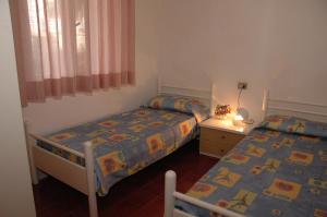 Postel nebo postele na pokoji v ubytování Appartamenti Vacanza Albatros