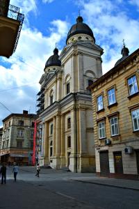 a large building with a tower on top of it at Apartment On Yana Zhizhky in Lviv