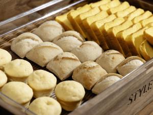 a display case filled with buns and bread at KOKO HOTEL Tokyo Nishikasai in Tokyo