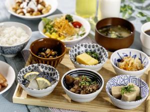 a group of bowls of food on a table at KOKO HOTEL Tokyo Nishikasai in Tokyo