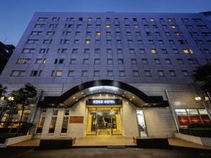 a large building with the door open in front of it at KOKO HOTEL Tokyo Nishikasai in Tokyo