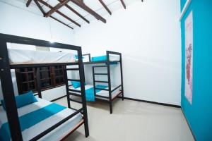 a room with two bunk beds and a window at Breeze Budget Unawatuna in Galle