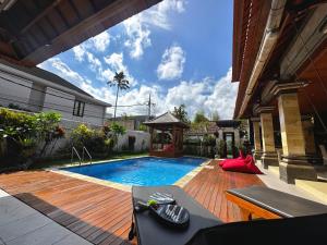 Πισίνα στο ή κοντά στο Soluna Homestay Bali