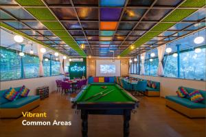 a billiard room with a pool table in it at goSTOPS Mussoorie Clock Tower in Mussoorie